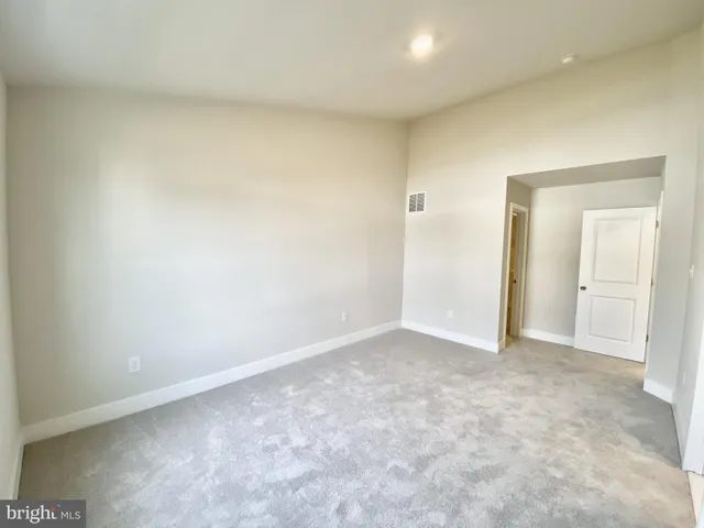 a view of a house with wooden deck