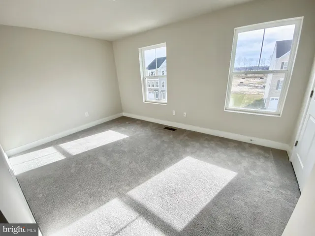 a bathroom with a sink a toilet a mirror a bathtub and shower