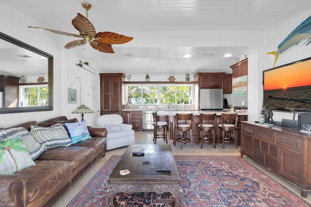 a kitchen with granite countertop a sink and a stove top oven
