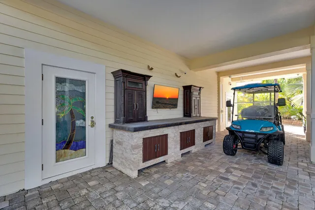a bedroom with a bed cabinet and window