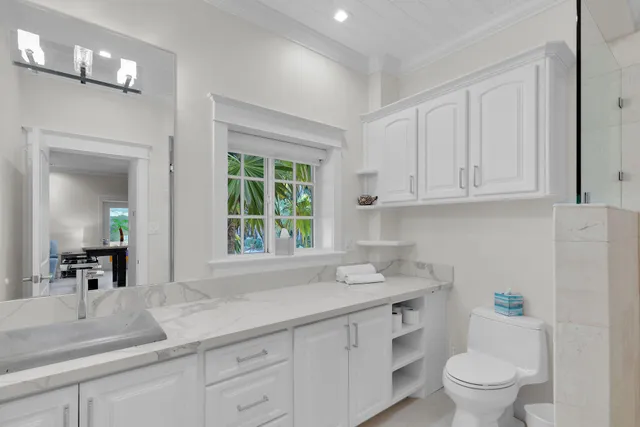 a kitchen with kitchen island granite countertop wooden cabinets and a stove