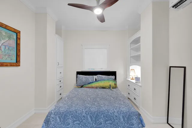 a view of a swimming pool with a chair and potted plants