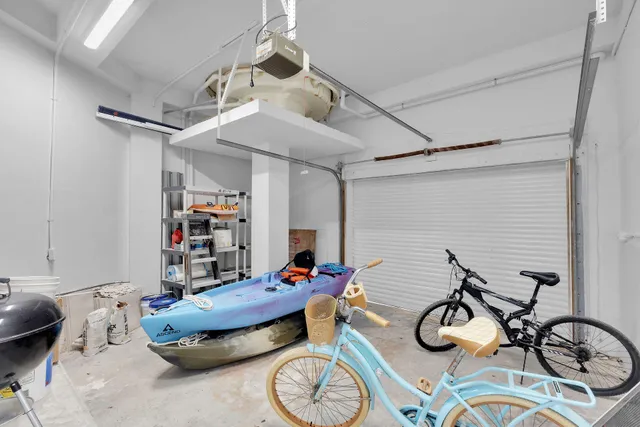 a view of a swimming pool with a yard and palm trees
