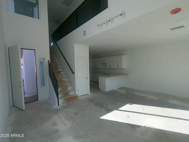 a view of a hallway with staircase