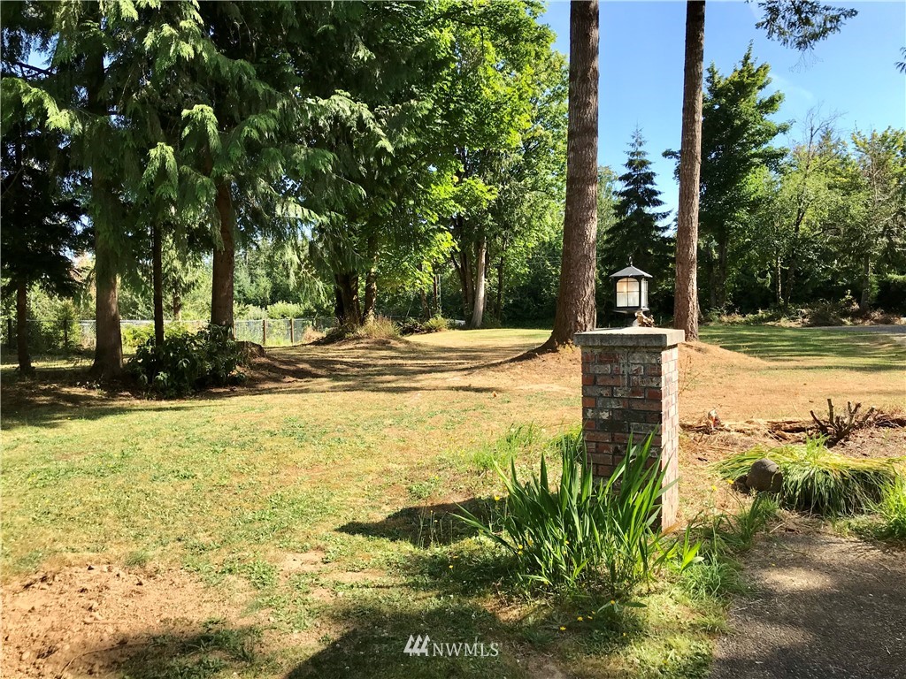 173 River Heights Road Centralia, WA 98531 - Photo 36 of 40 a view of a yard with an trees