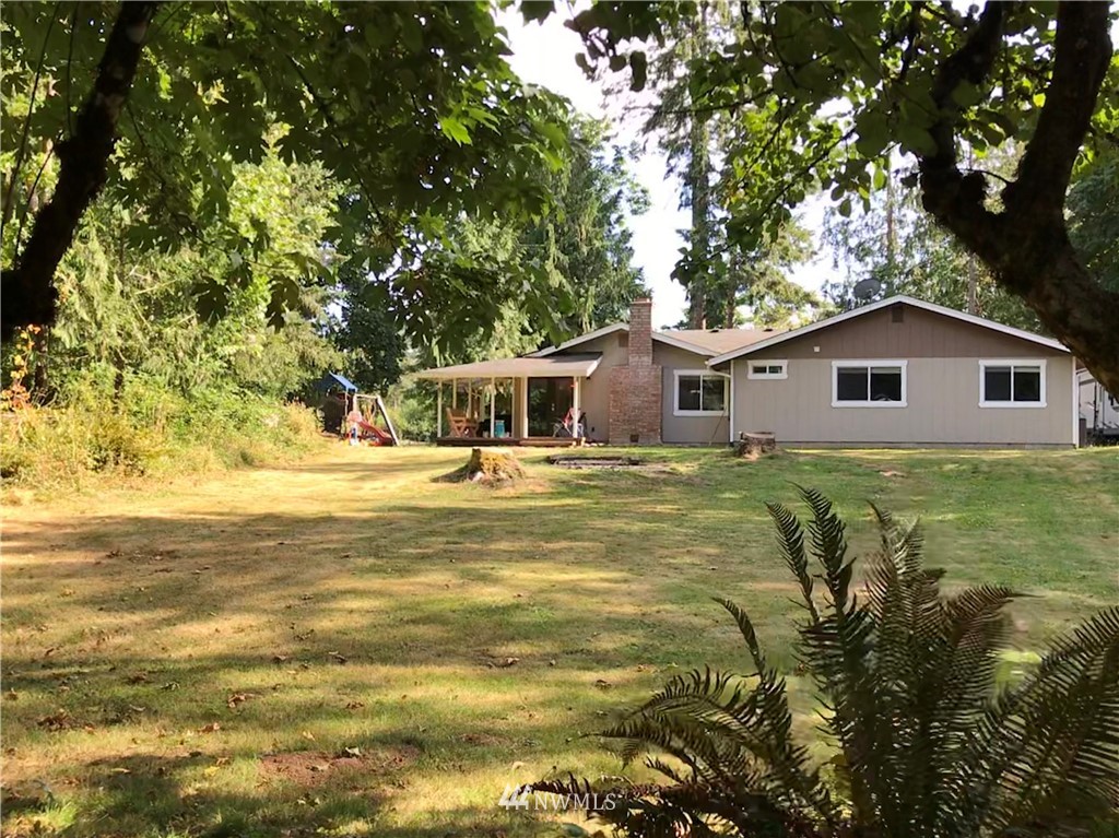 173 River Heights Road Centralia, WA 98531 - Photo 39 of 40 a house with swimming pool in front of it