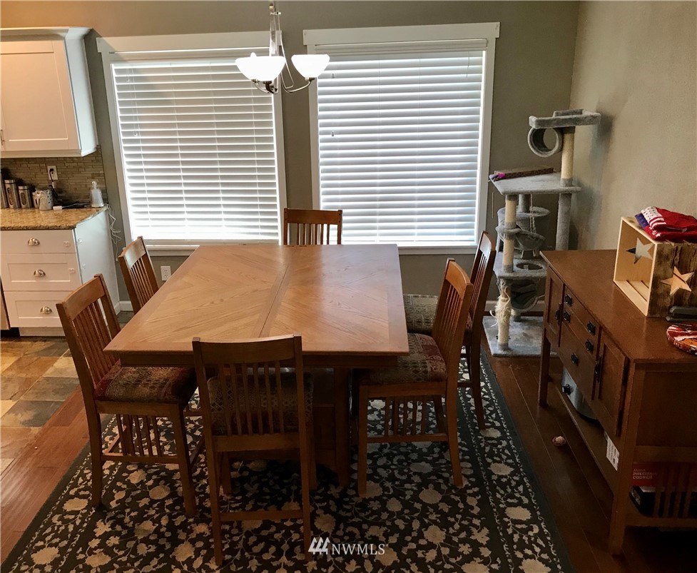 173 River Heights Road Centralia, WA 98531 - Photo 9 of 40 a view of a dining room with furniture and wooden floor