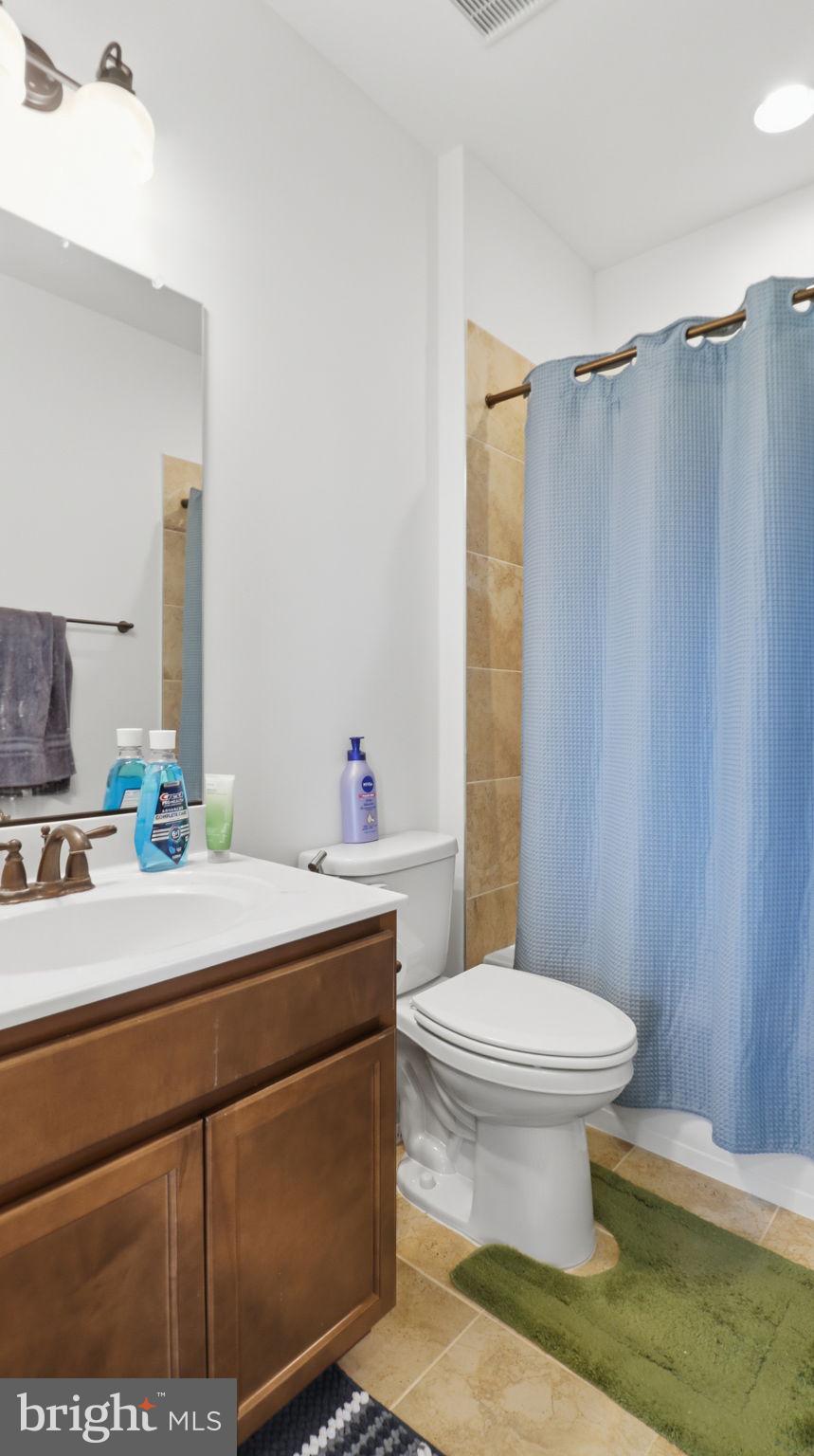11502 Aden Road Nokesville, VA 20181 - Photo 90 of 106 a bathroom with a sink toilet and shower
