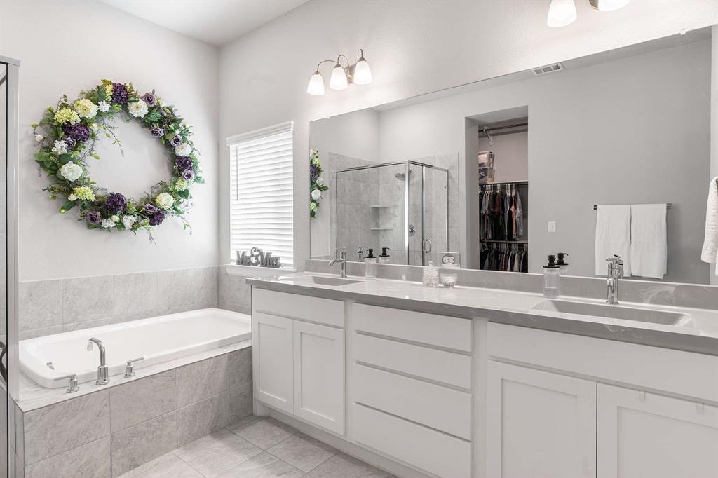 1609 Cotton Road Van Alstyne, TX 75495 - Photo 16 of 27 a bathroom with a granite countertop sink mirror and bathtub