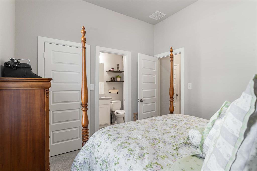 1609 Cotton Road Van Alstyne, TX 75495 - Photo 17 of 27 a bedroom with a bed and cabinets