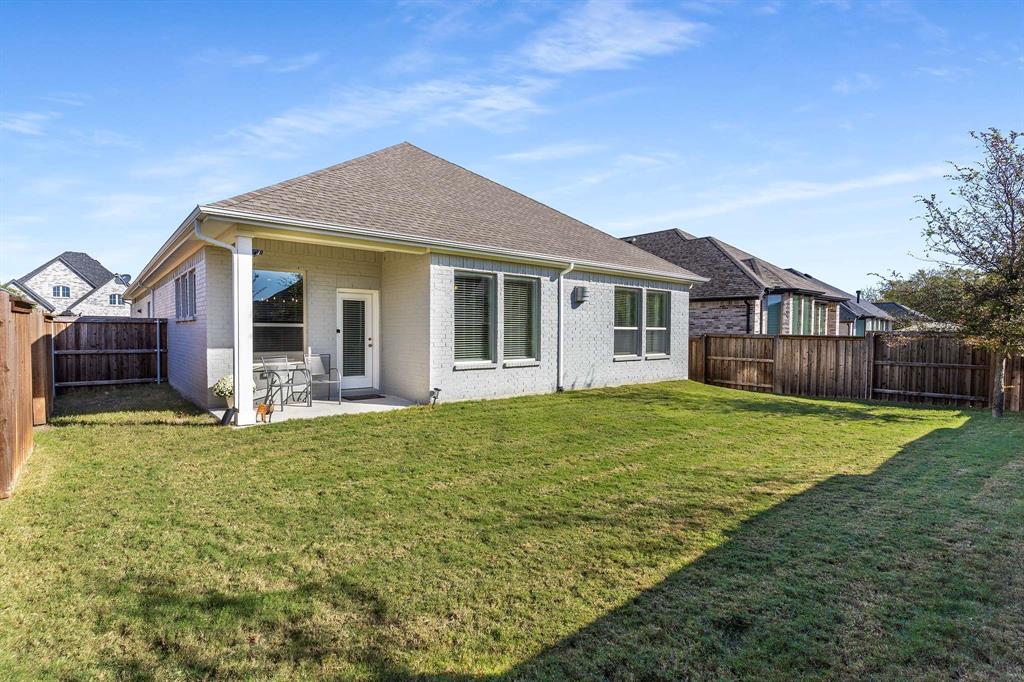 1609 Cotton Road Van Alstyne, TX 75495 - Photo 23 of 27 a view of a house with backyard and garden