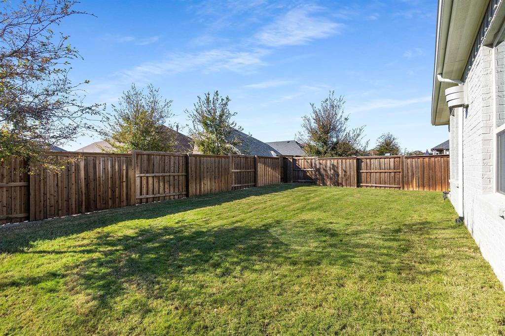 1609 Cotton Road Van Alstyne, TX 75495 - Photo 24 of 27 a view of a backyard with a garden