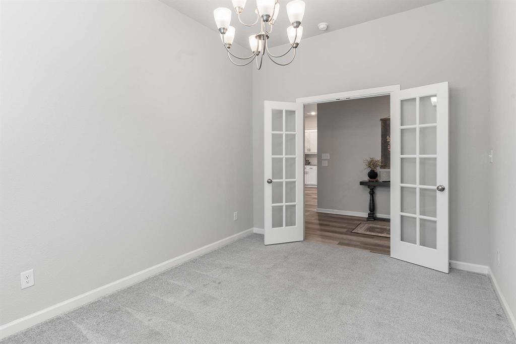 1609 Cotton Road Van Alstyne, TX 75495 - Photo 6 of 27 wooden floor in an empty room with a window