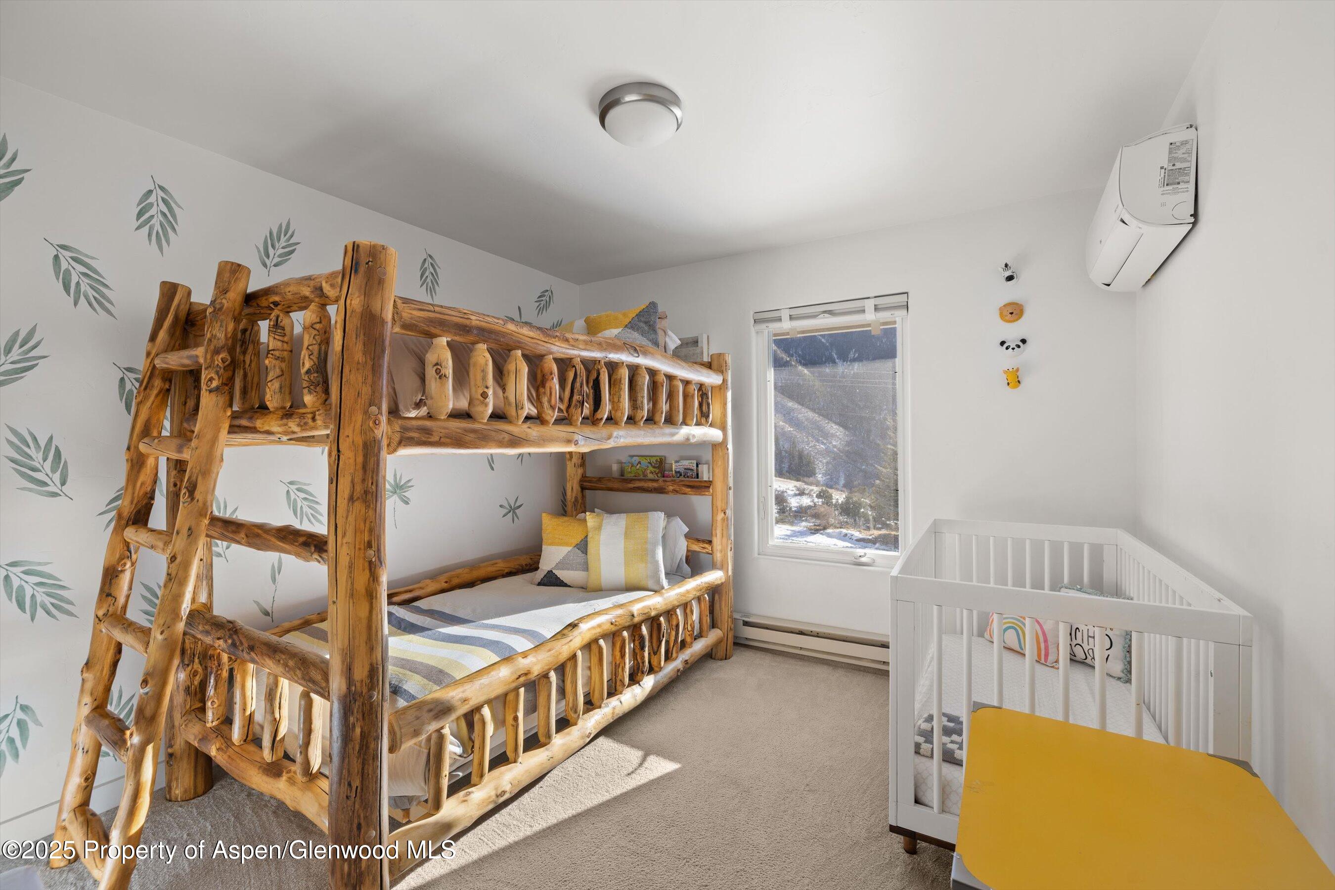 163 Castle Lane Basalt, CO 81621 - Photo 15 of 28 a bedroom with furniture and a window