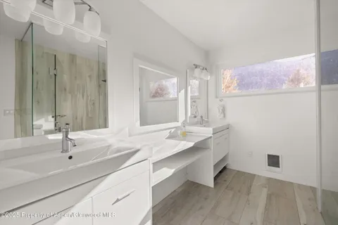 a view of balcony with wooden floor and seating space