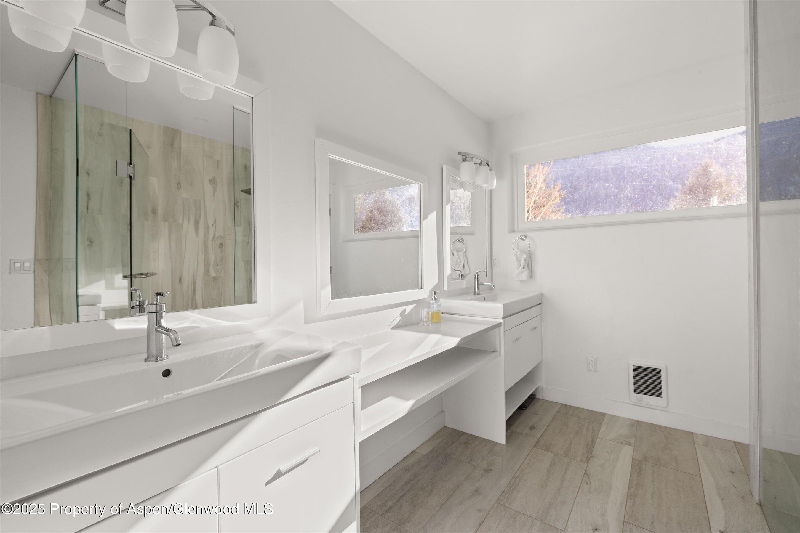 163 Castle Lane Basalt, CO 81621 - Photo 18 of 28 a bathroom with a double vanity sink and a mirror