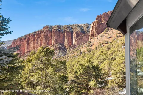 a view of balcony with wooden floor