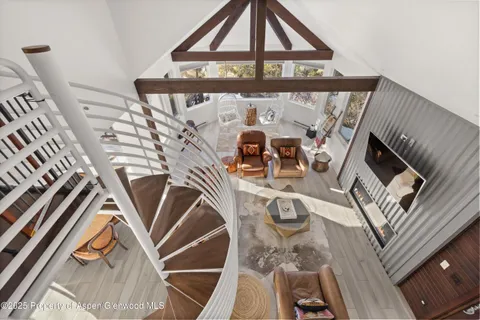 a kitchen with kitchen island a sink stove and refrigerator