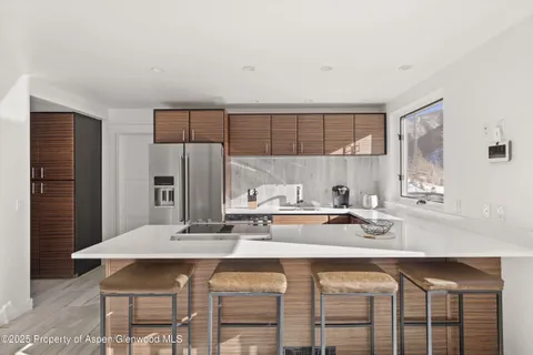 a view of a dining room kitchen and furniture