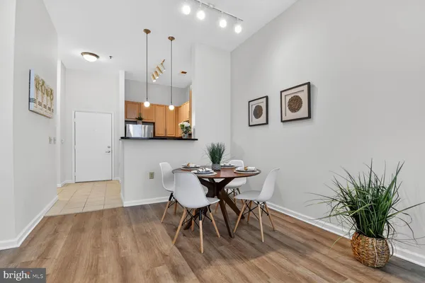 a view of a room with furniture and wooden floor