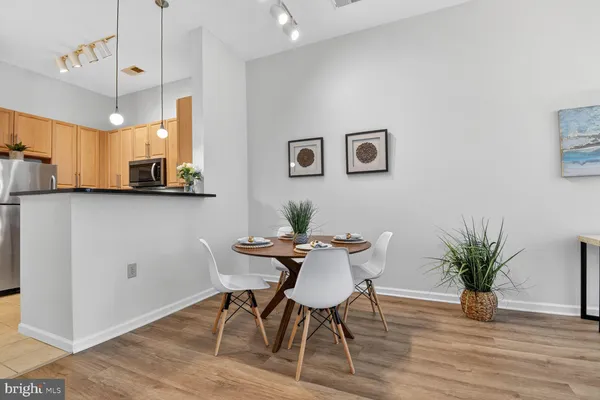 a view of a dining room with furniture and wooden floor