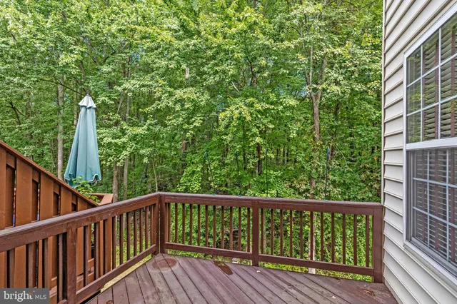 a view of balcony with deck and wooden floor