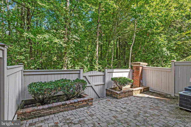 a view of a bench in the backyard