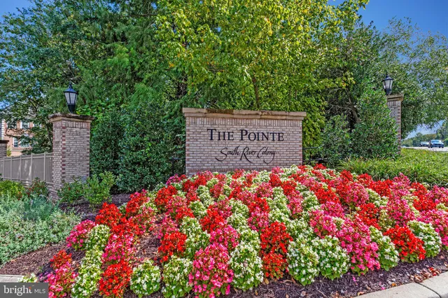 a sign that is in front of flowers