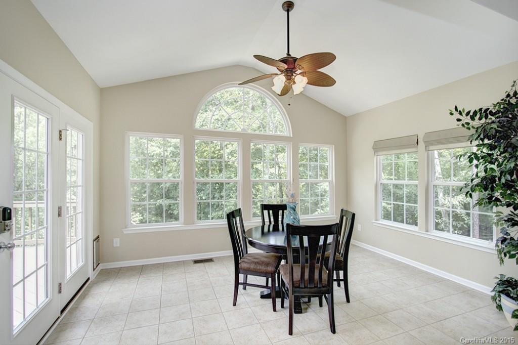 674 Reliance Court Tega Cay, SC 29708 - Photo 12 of 24 a dining room with furniture window a chandelier and wooden floor