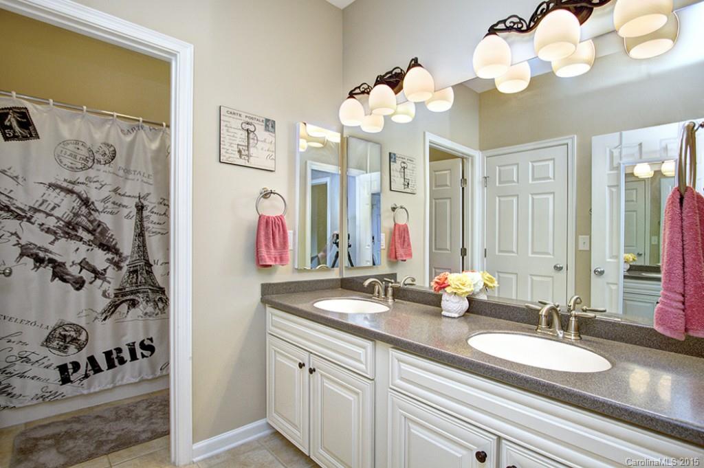 674 Reliance Court Tega Cay, SC 29708 - Photo 18 of 24 a bathroom with a sink vanity and a mirror