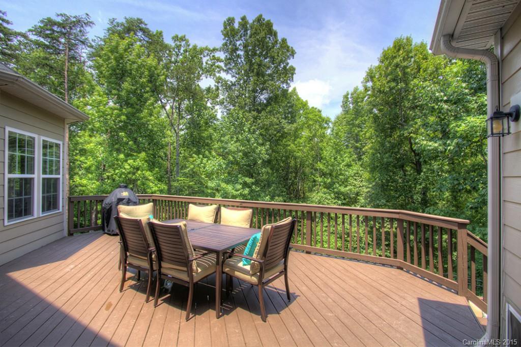 674 Reliance Court Tega Cay, SC 29708 - Photo 22 of 24 a view of a deck with table and chairs and wooden floor