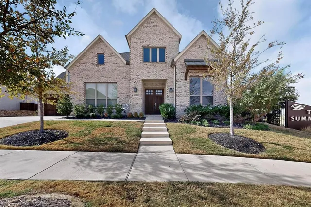 a front view of a house with garage