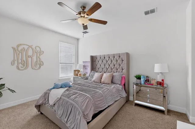 a living room with furniture pool table and a window