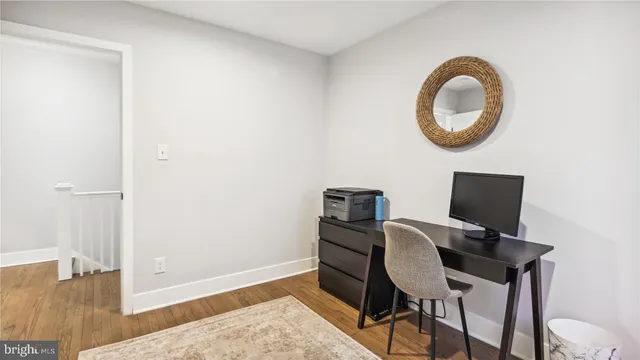 a workspace with furniture hardwood and a window