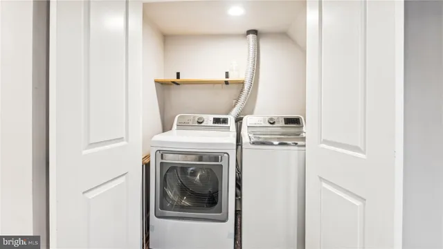 a view of house with backyard and sitting area