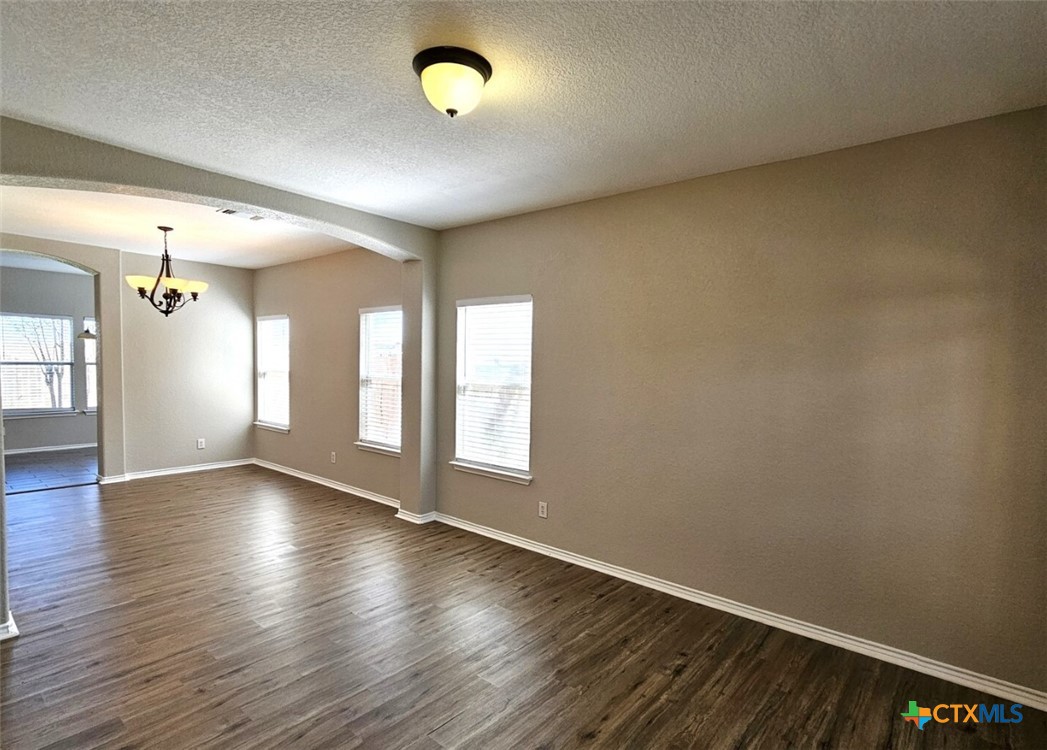 316 Julian Point Cibolo, TX 78108 - Photo 13 of 28 a view of an empty room with window and wooden floor
