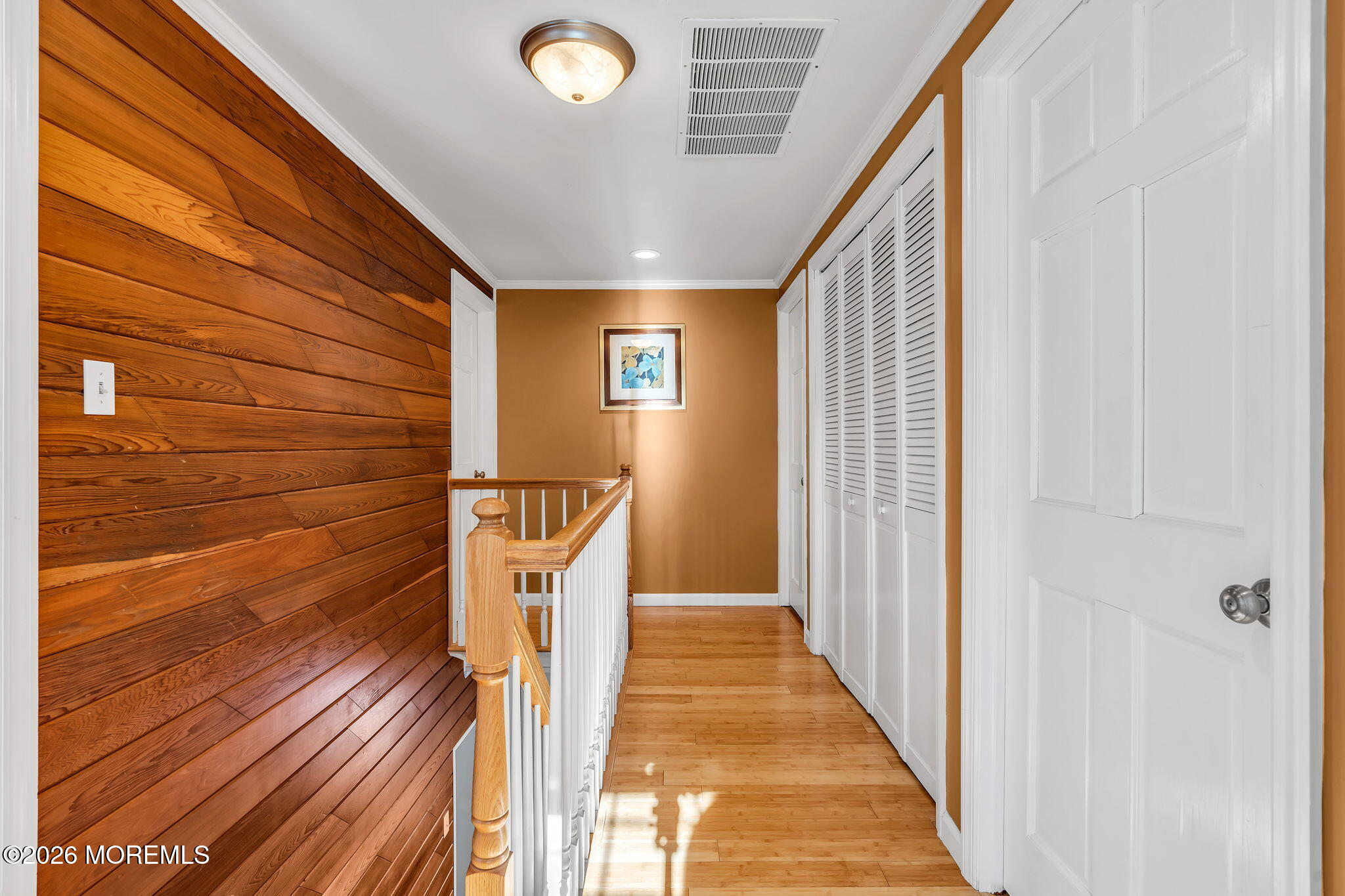 72 Idlebrook Lane Aberdeen, NJ 07747 - Photo 29 of 46 a view of a hallway with wooden floor and staircase