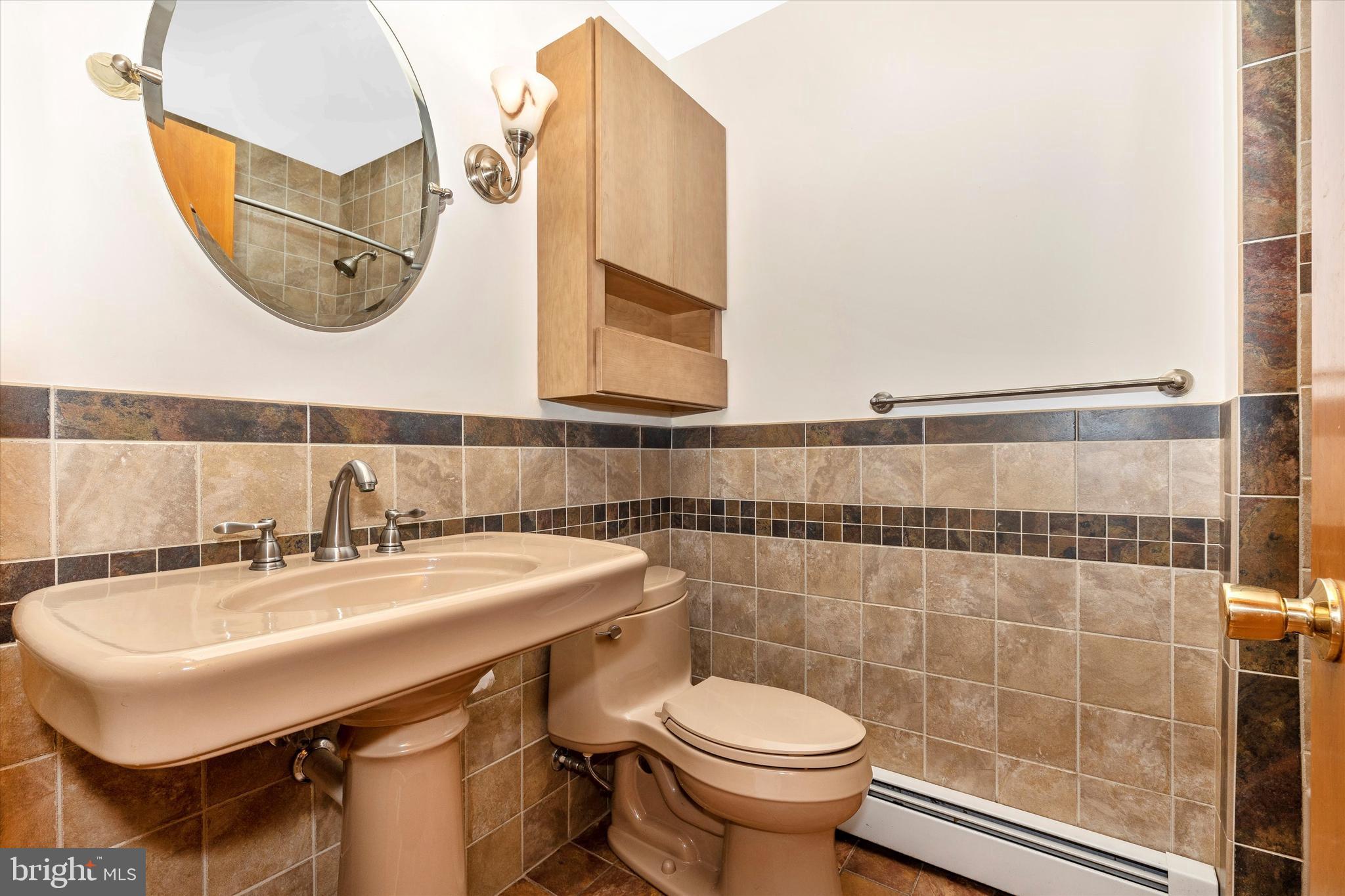 8911 Yellow Springs Road Frederick, MD 21702 - Photo 33 of 37 a bathroom with a sink and a mirror