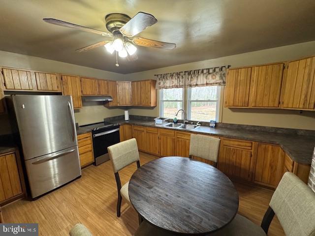 9285 Old Stagecoach Road La Plata, MD 20646 - Photo 2 of 14 a kitchen with granite countertop a refrigerator a sink dishwasher a stove and white countertops with wooden floor