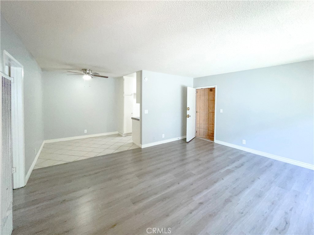 13717 Chadron Avenue, Unit 16 Hawthorne, CA 90250 - Photo 4 of 11 a view of an empty room with wooden floor