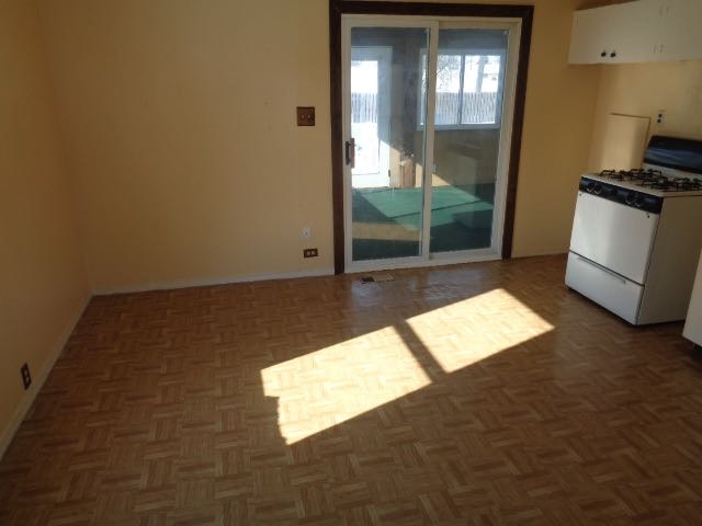 446 Montrose Drive Romeoville, IL 60446 - Photo 6 of 23 a view of an empty room and wooden floor