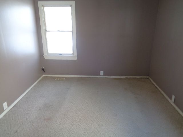 446 Montrose Drive Romeoville, IL 60446 - Photo 9 of 23 an empty room with a window