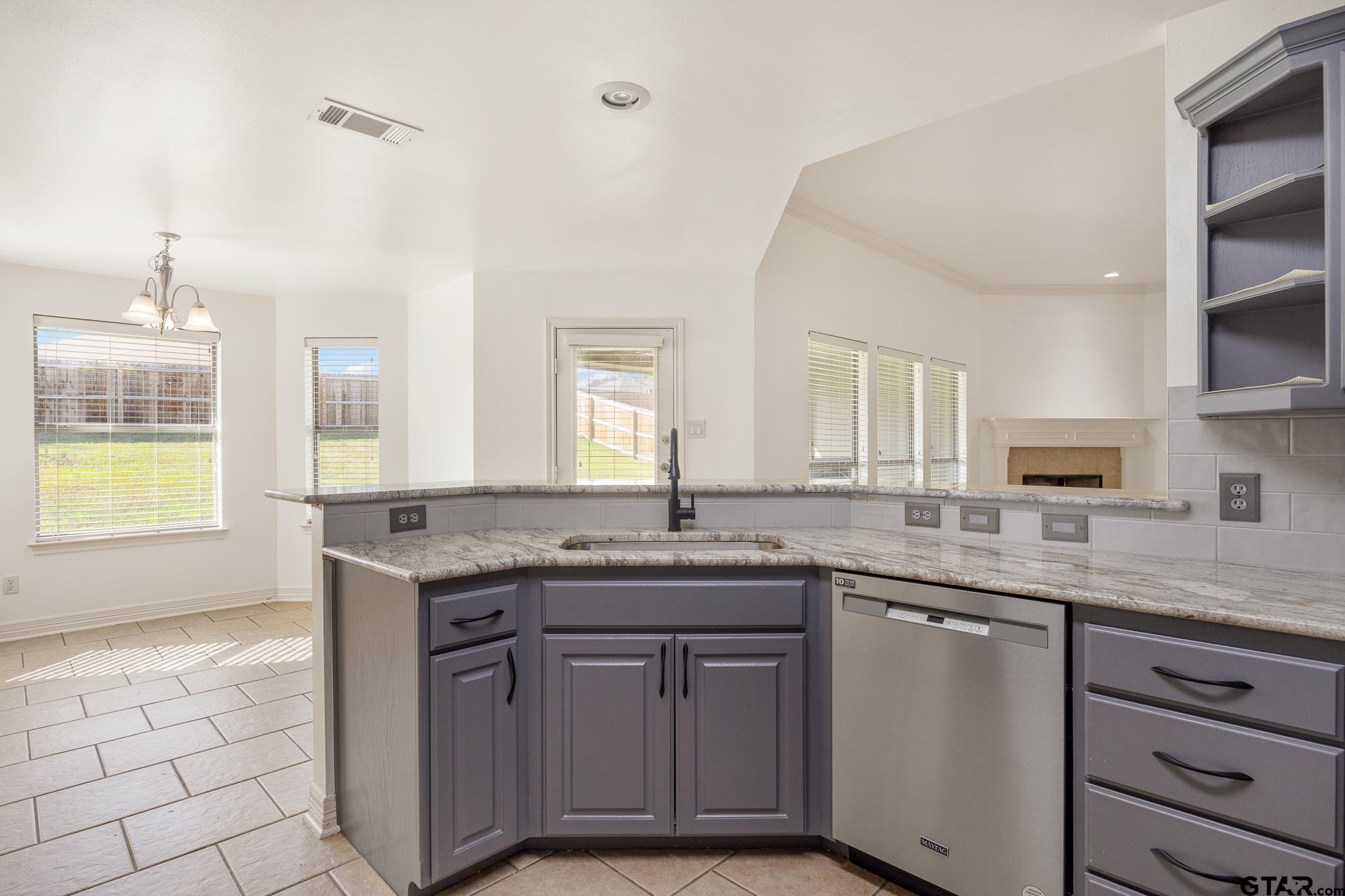 209 Cass Circle Tyler, TX 75703 - Photo 13 of 33 a kitchen with a sink and cabinets