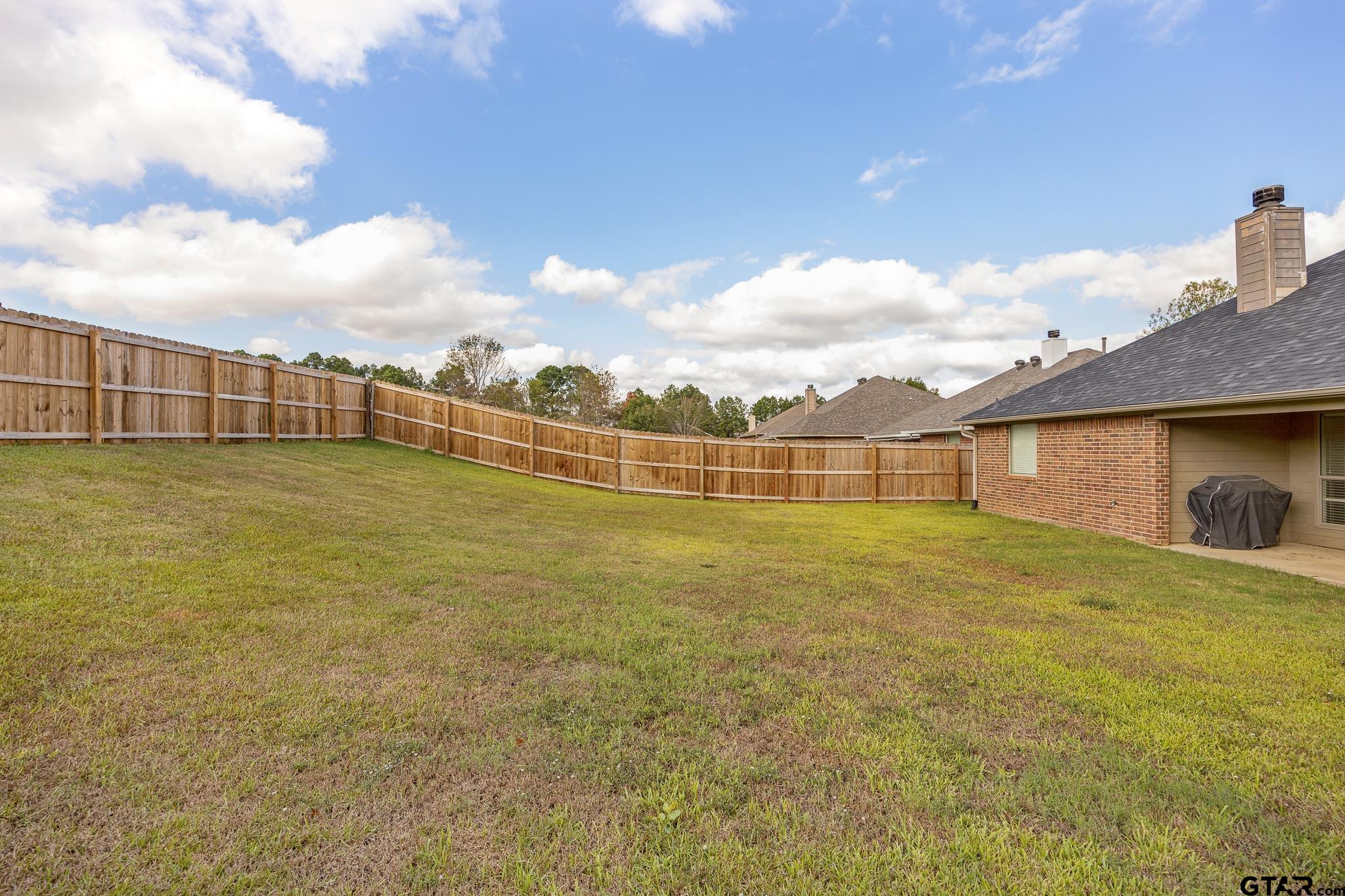 209 Cass Circle Tyler, TX 75703 - Photo 32 of 33 a view of a large house with a yard