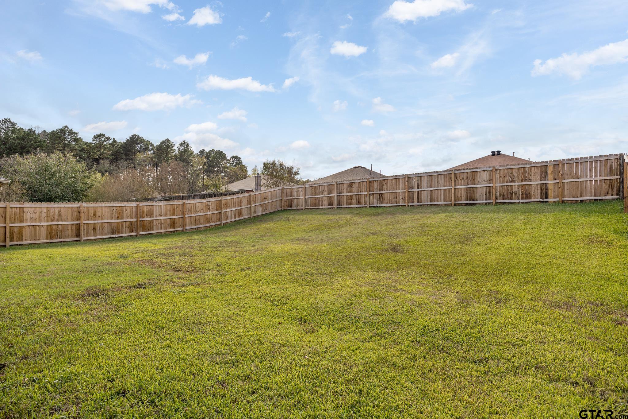 209 Cass Circle Tyler, TX 75703 - Photo 33 of 33 a view of a large pool with lawn chairs and large trees
