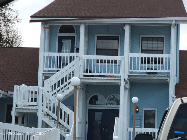 a view of a brick building with many windows