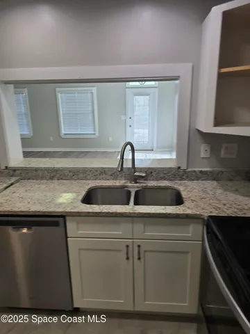 a kitchen with a sink and cabinets