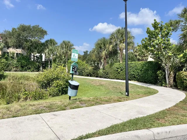 a swimming pool with lots of green space