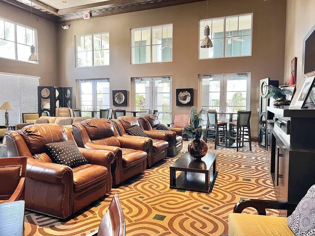 a living room with furniture fireplace and a window