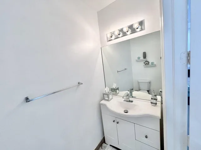 a bathroom with a sink and mirror